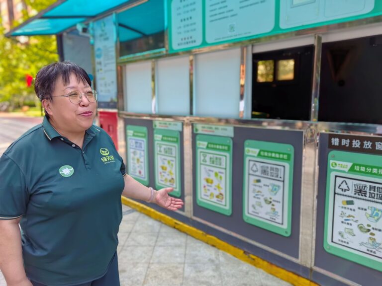 Mrs. Xu eplains the waste recycling project at the organic compound